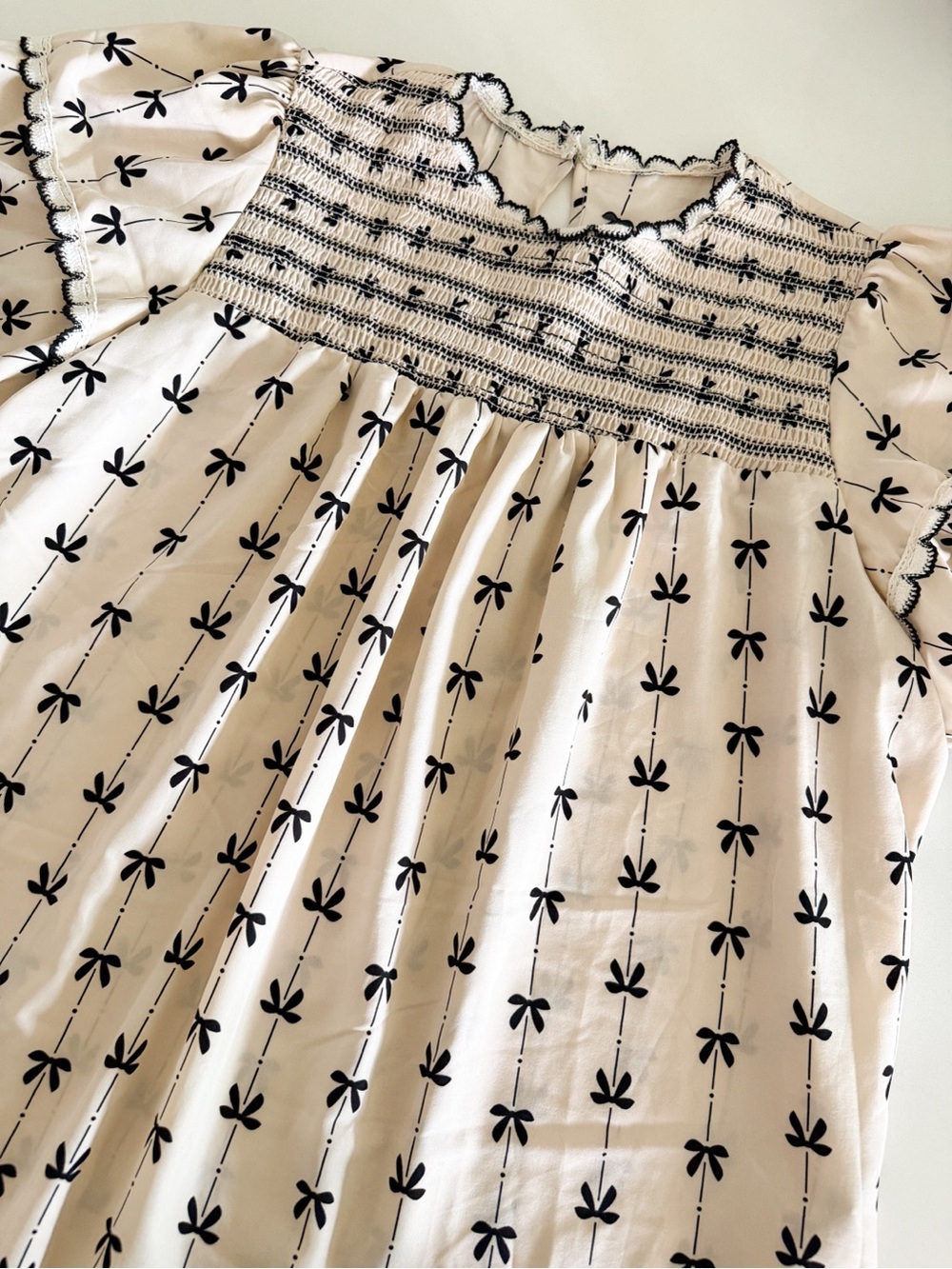 SHEIN Cream Smocked Blouse with Black Bow Print